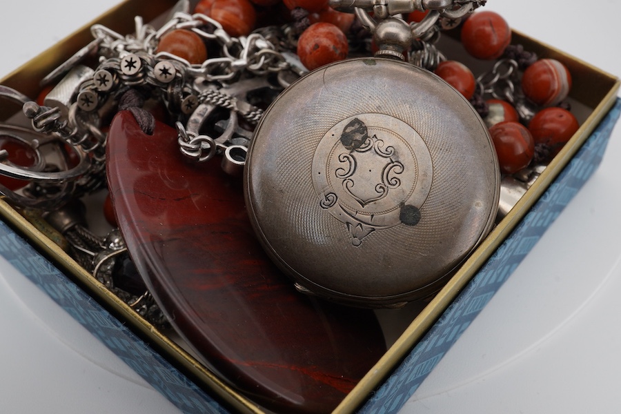 A mixed group of silver jewellery, including two charm bracelets, an Art Nouveau-style pendant; a pocket watch on chain; a pair of moonstone earrings; an onyx and marcasite pendant; a cross pendant; a carnelian pendant;